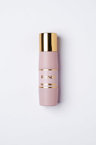 Pink Perfume bottle with gold cap and text on a white background by Atyab Al Marshoud.
