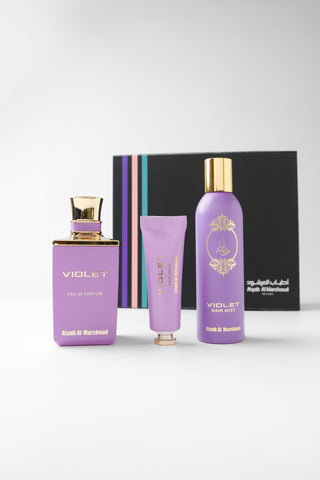 Violet set with bottles and packaging on a white background by Atyab Al Marshoud.