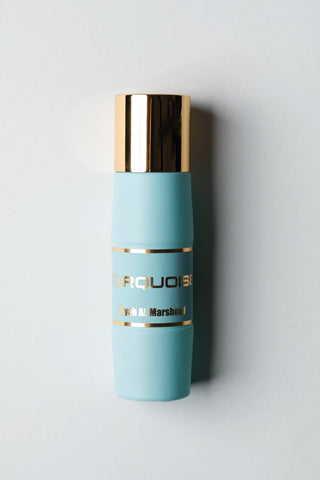 Blue Perfume bottle with gold cap and Branding of the Pefume turquoise by Atyab Al Marshoud.